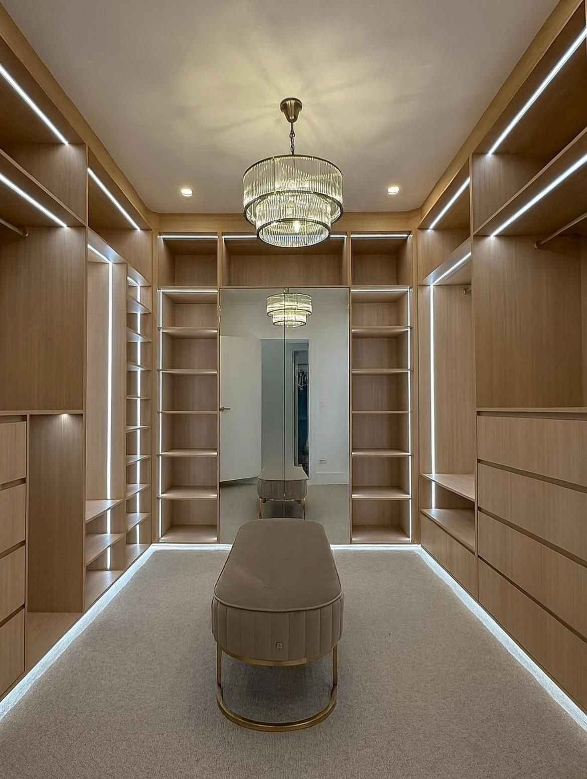 Built-in timber-veneer wardrobe and storage cabinetry