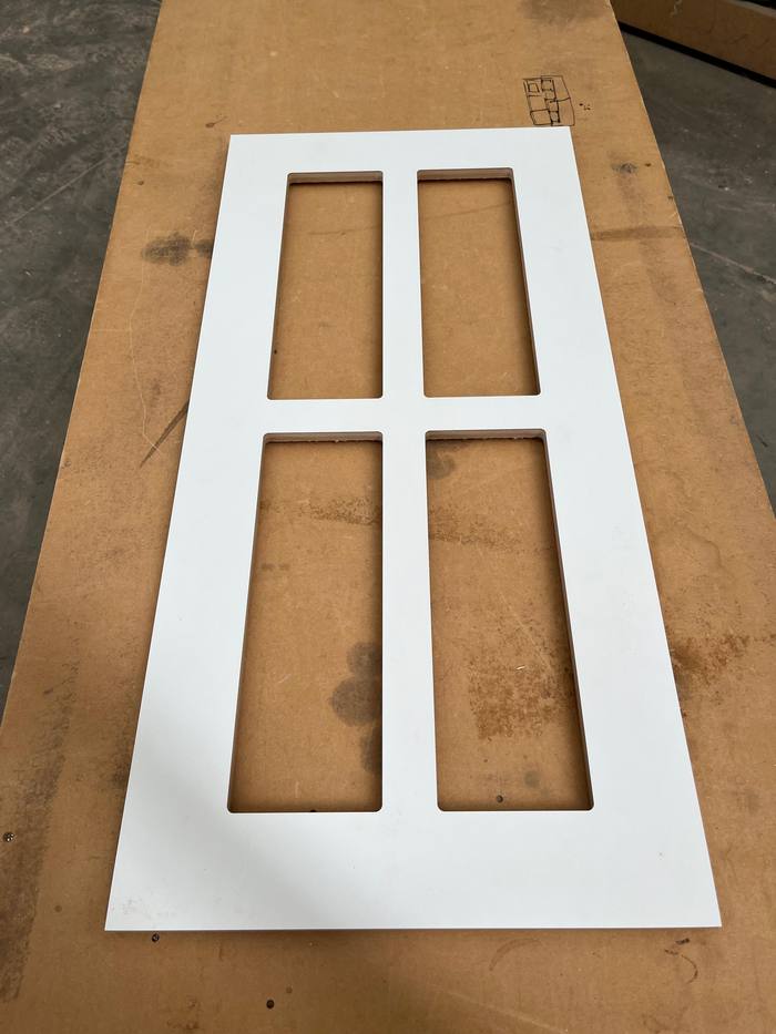 White four-panel shaker style cabinet door